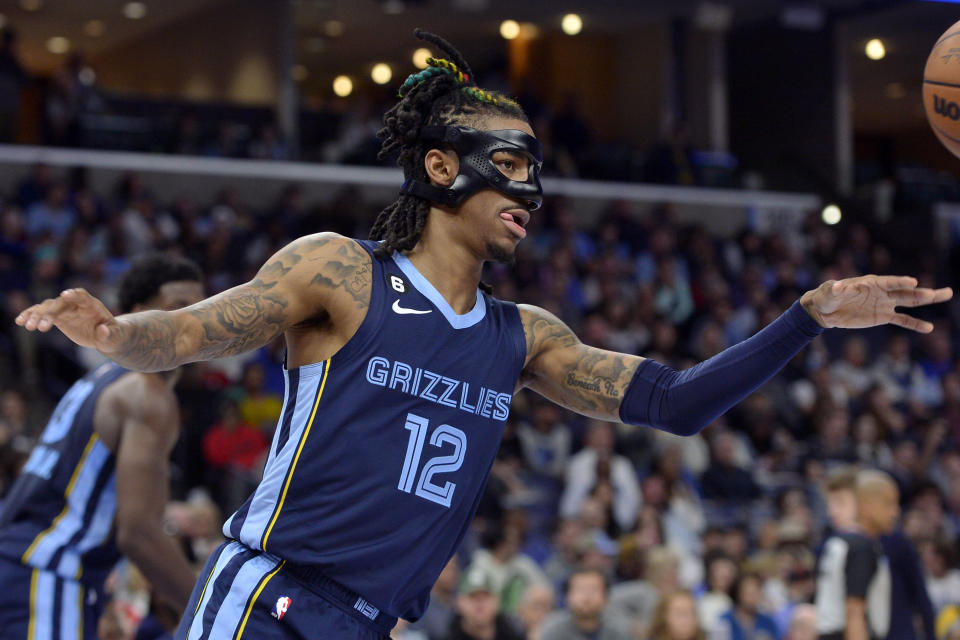 Memphis Grizzlies guard Ja Morant (12) plays in the first half of an NBA basketball game against the Houston Rockets Wednesday, March 22, 2023, in Memphis, Tenn. (AP Photo/Brandon Dill)