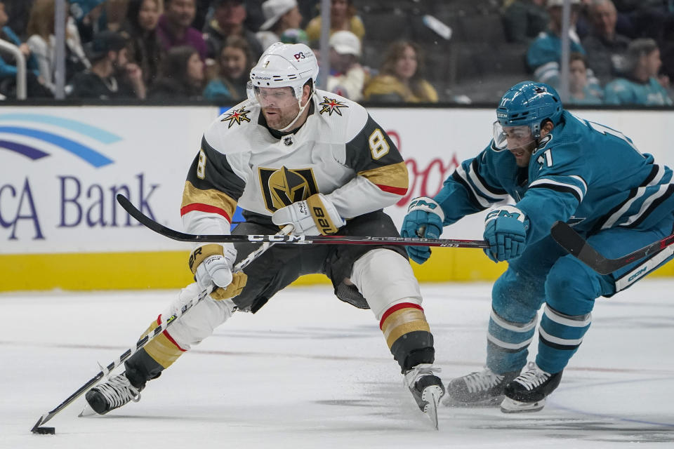 San Jose Sharks center Luke Kunin (11) chases after Vegas Golden Knights center Phil Kessel (8) during the second period of an NHL hockey game in San Jose, Calif., Tuesday, Oct. 25, 2022. (AP Photo/Godofredo A. Vásquez)