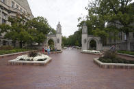 Students walk to classes on the Indiana University campus, Thursday, Oct. 14, 2021, in Bloomington, Ind. College communities such as Bloomington are exploring their options for contesting the results of the 2020 census, which they say do not accurately reflect how many people live there. (AP Photo/Darron Cummings)