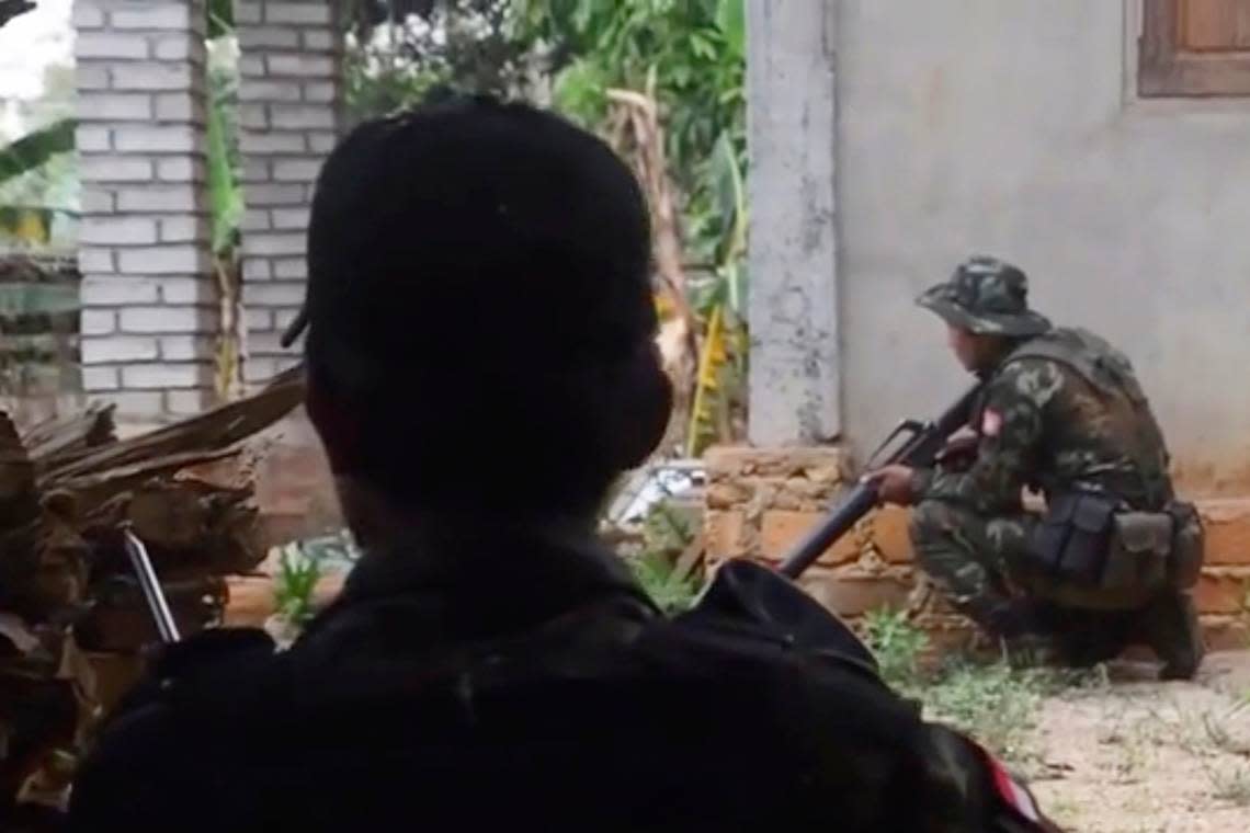 In this image from video provided by a militia operating in the region, anti-junta militia members perform an operation at the front line in the Kayah state of Myanmar on April 22, 2022. (Karenni Nationalities Defense Force via AP)