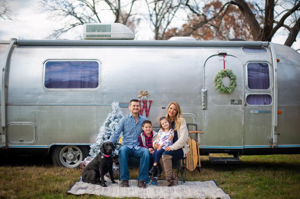 Family photo of Jesse and Caroline Wasson along with their kids Bennett and Harlynn in Springfield, MO. The family has a 1970 Airstream Overlander.