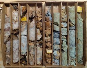 Core Box for Hole ISB20-1 from 24.5 m to 29.1 m showing quartz vein and intensely altered and brecciated leucocratic granite wallrock. Each core box row is 50 cm in length.