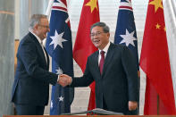 Chinese Premier Li Qiang and Australia's Prime Minister Anthony Albanese shake hands at Parliament House in Canberra, Australia, Monday, June 17, 2024. Li, Albanese and senior ministers of both administrations met at Parliament House on Monday to discuss thorny issues, including lingering trade barriers, conflict between their militaries in international waters and China's desire to invest in critical minerals. (Mick Tsikas/Pool Photo via AP)