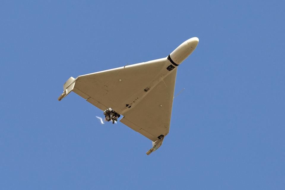 An Iranian-made Shahed-136 drone flies in the sky over Kermanshah, Iran, on March 7.