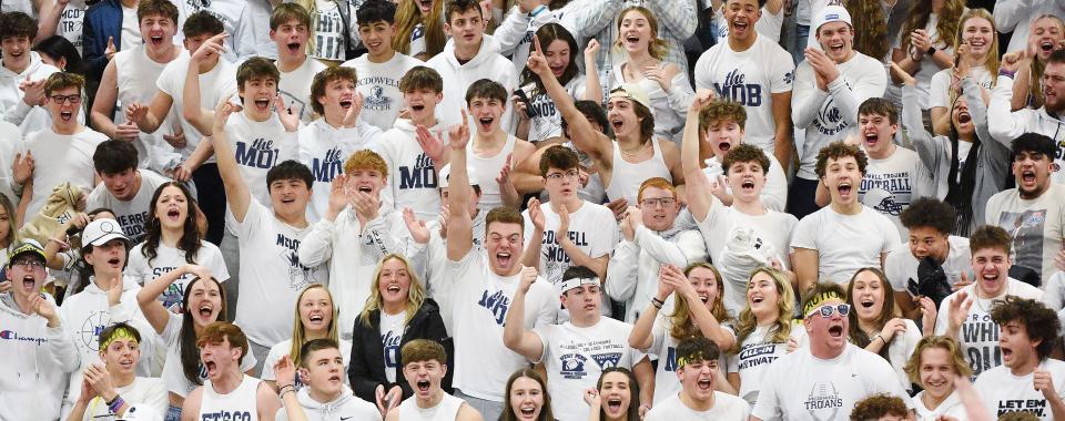 McDowell High School students cheer during a boys basketball game against Cathedral Prep in Millcreek Township on Feb. 17, 2023. 