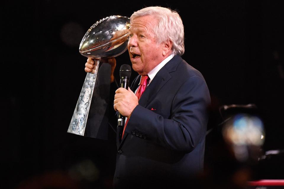 Robert Kraft holding Super Bowl LI Trophy