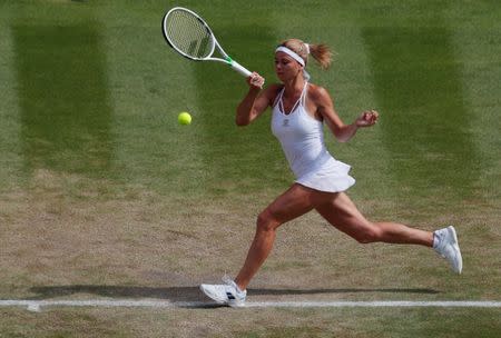 Tennis - Wimbledon - All England Lawn Tennis and Croquet Club, London, Britain - July 10, 2018 Italy's Camila Giorgi reacts in action during her quarter final match against Serena Williams of the U.S. REUTERS/Andrew Couldridge