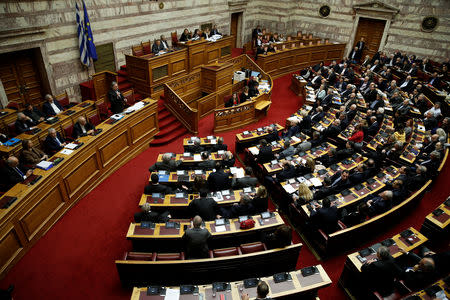 Greek Alternate Minister of Foreign Affairs George Katrougalos addresses lawmakers during a parliamentary session on a name-change agreement with neighbouring Macedonia in Athens, Greece, January 23, 2019. REUTERS/Costas Baltas