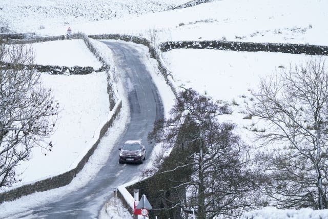 A car drives along an icy road