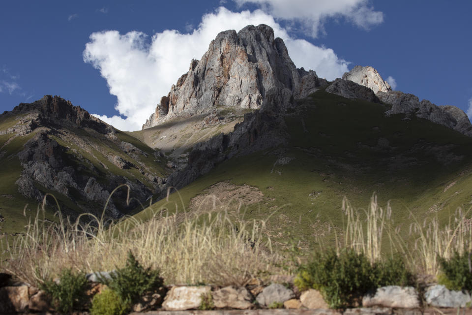 Peaks reach toward the sky in Angsai, an area inside the Sanjiangyuan region in western China's Qinghai province on Sunday, Aug. 25, 2019. Ringed by the world’s tallest mountain ranges, the region long known as “the rooftop of the world” is now in the crosshairs of China’s latest modernization push. But this time, the Chinese government wants to set limits on the region’s growth in order to implement its own version of one of the U.S.’s proudest legacies _ a national park system. (AP Photo/Ng Han Guan)