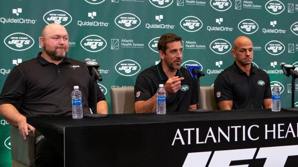 New York Jets general manager Joe Douglas (left) quarterback Aaron Rodgers (center) and head coach Robert Saleh (right) talk to the media during the introductory press conference.