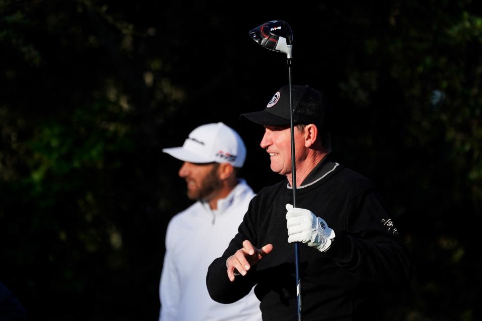 PEBBLE BEACH, CALIFORNIA - FEBRUARY 07:  Wayne Gretzky plays his shot from the second tee as Dustin Johnson of the United States looks on during the first round of the AT&T Pebble Beach Pro-Am at Monterey Peninsula Country Club Shore Course on February 07, 2019 in Pebble Beach, California. (Photo by Cliff Hawkins/Getty Images)
