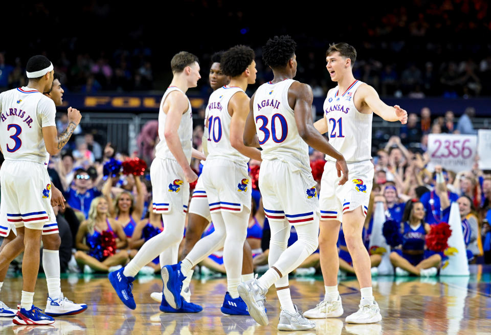 NEW ORLEANS, LOUISIANA - APRIL 02: Zach Clemence #21 of the Kansas Jayhawks reacts with his team as they take on the Villanova Wildcats during the second half in the semifinal game of the 2022 NCAA Men's Basketball Tournament Final Four at Caesars Superdome on April 02, 2022 in New Orleans, Louisiana. (Photo by Brett Wilhelm/NCAA Photos via Getty Images)