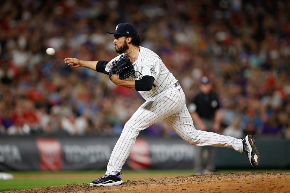 Colorado Rockies relief pitcher Justin Lawrence (61) pitches in the ninth inning against the St. Louis Cardinals at Coors Field on July 2, 2021. Mandatory Credit: Isaiah J. Downing-USA TODAY Sports