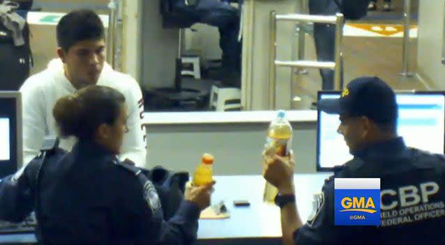 In footage, two border protection officers can be seen gesturing for Cruz Velazquez to drink from the bottles he was trying to bring in. Picture: ABC News