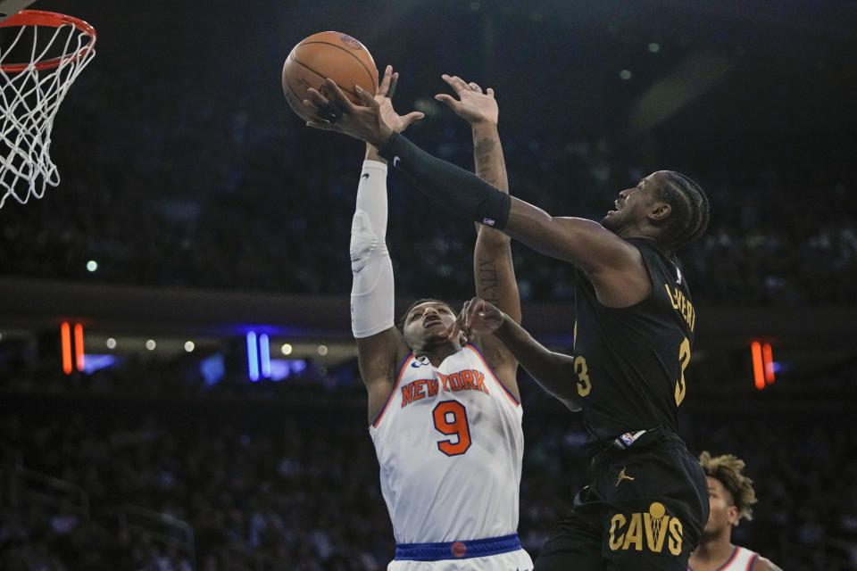 Cleveland Cavaliers' Caris LeVert, right, drives past New York Knicks' RJ Barrett (9) during the first half of an NBA basketball game Tuesday, Jan. 24, 2023, in New York. (AP Photo/Frank Franklin II)
