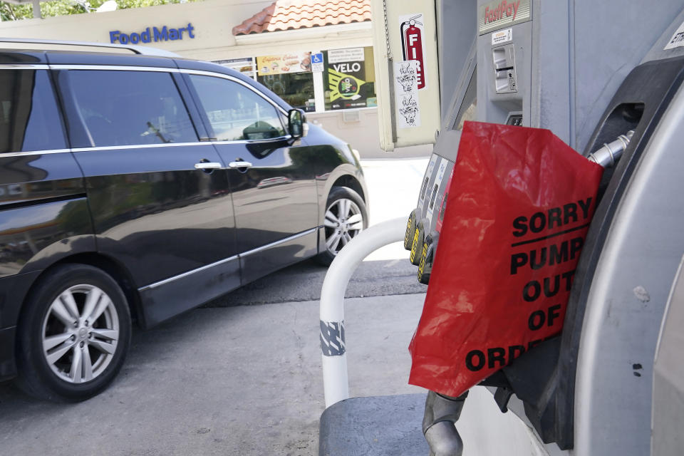 A customer drives from a Chevron station after it ran out of gasoline, Wednesday, May 12, 2021, in Miami. State and federal officials are scrambling to find alternate routes to deliver gasoline in the Southeast U.S. after a hack of the nation's largest fuel pipeline led to panic-buying that contributed to more than 1,000 gas stations running out of fuel. The pipeline runs from the Gulf Coast to the New York metropolitan region. (AP Photo/Marta Lavandier)