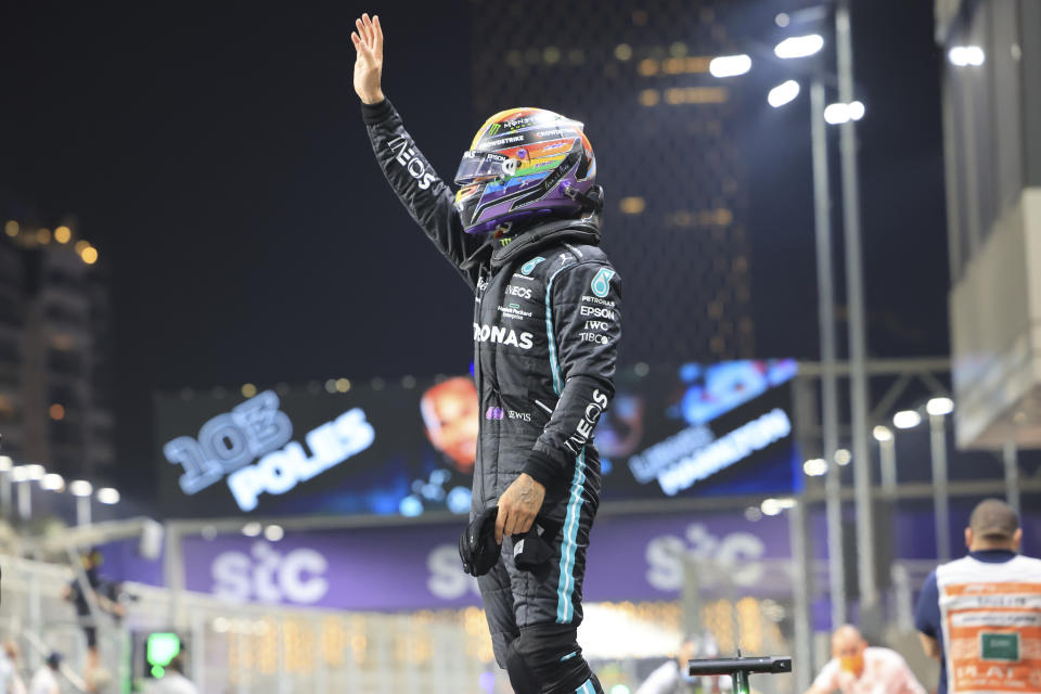 Mercedes driver Lewis Hamilton of Britain celebrates after winning pole position for the Formula One Saudi Arabian Grand Prix in Jiddah, Saturday, Dec. 4, 2021.(Giuseppe Cacace, Pool via AP)