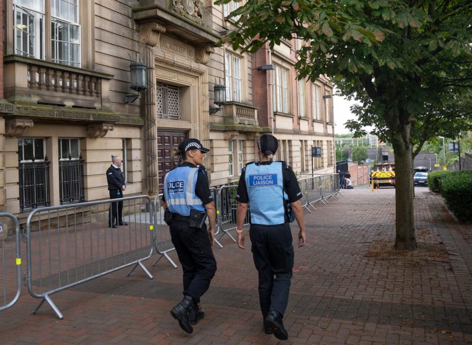 Police Liaison officers patrolled outside County Hall in Preston on the first day of the inquest (Danny Lawson/PA Wire)