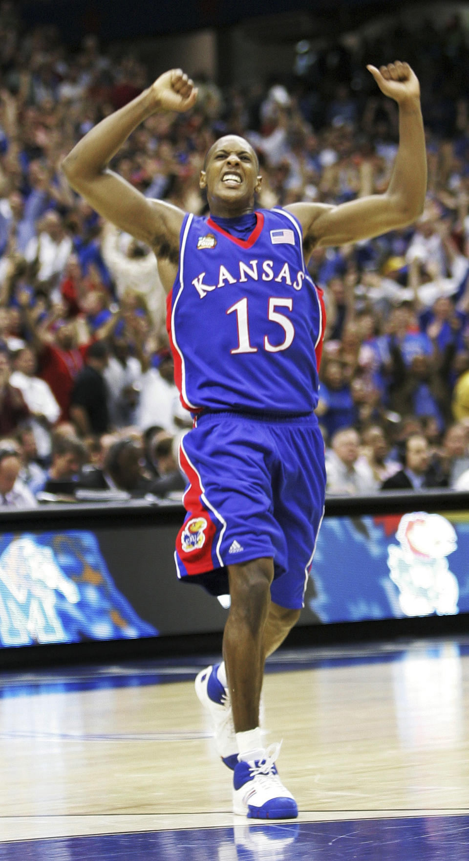 FILE - Kansas' Mario Chalmers (15) celebrates after hitting a three point shot to take the game into overtime against Memphis during the championship game at the NCAA college basketball Final Four in San Antonio, Monday, April 7, 2008. (AP Photo/Eric Gay, File)