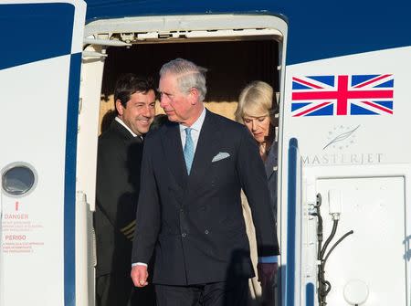 Britain's Prince Charles, Prince of Wales, and his wife Camilla, Duchess of Cornwall, arrive at Joint Base Andrews in Maryland on March 17, 2015. REUTERS/Nicholas Kamm/Pool