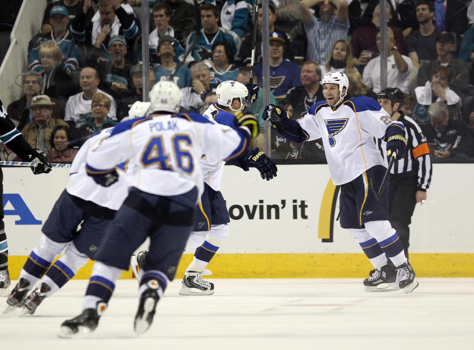 SAN JOSE, CA - APRIL 19: B.J. Crombeen #26 of the St. Louis Blues is congratulated by teammates after he scored in a goal in the first period of their game against the San Jose Sharks in Game Four of the Western Conference Quarterfinals during the 2012 NHL Stanley Cup Playoffs at HP Pavilion on April 19, 2012 in San Jose, California. (Photo by Ezra Shaw/Getty Images)