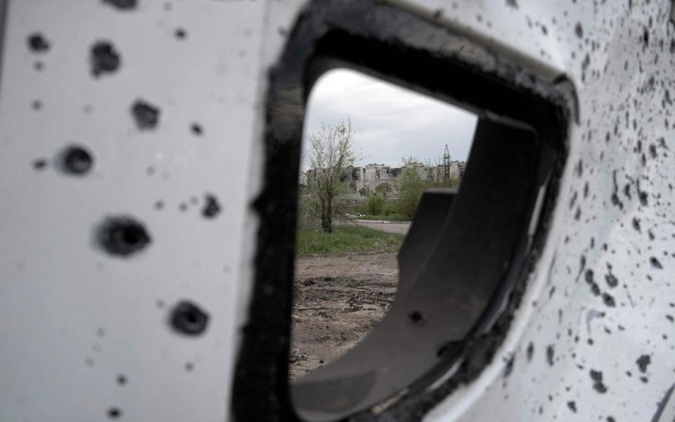 Russian missiles have reduced large parts of Mariupol to rubble - AFP