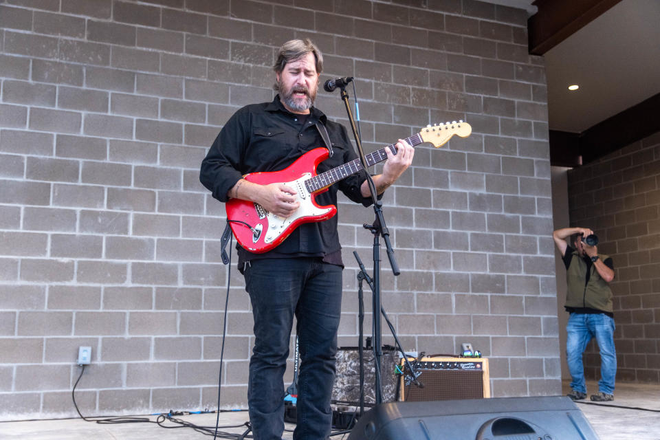 Singer-songwriter Zac Wilkerson entertains crowd at the inaugural performance for the AJ Swope Performance Plaza Friday night at the Arts in the Sunset in Amarillo.