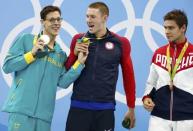 2016 Rio Olympics - Swimming - Victory Ceremony - Men's 200m Backstroke Victory Ceremony - Olympic Aquatics Stadium - Rio de Janeiro, Brazil - 11/08/2016. Mitch Larkin (AUS) of Australia, Ryan Murphy (USA) of USA and Evgeny Rylov (RUS) of Russia pose with their medals. REUTERS/David Gray