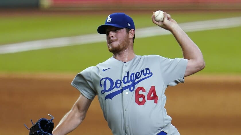 Los Angeles Dodgers' Caleb Ferguson throws against the Houston Astros during the eighth inning of a baseball game Tuesday, July 28, 2020, in Houston. (AP Photo/David J. Phillip)