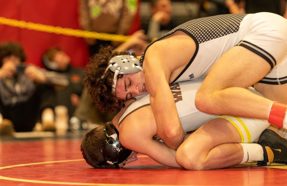 Bridgewater Raritan’s Daniel Smith (red) beats Watchung Hills Regional’s Jordan Bash (green) in the 132 weight class at the 2023 Somerset County Boys Wrestling Tournament on Jan. 7 at the gymnasium at Hillsborough High School in Hillsborough.