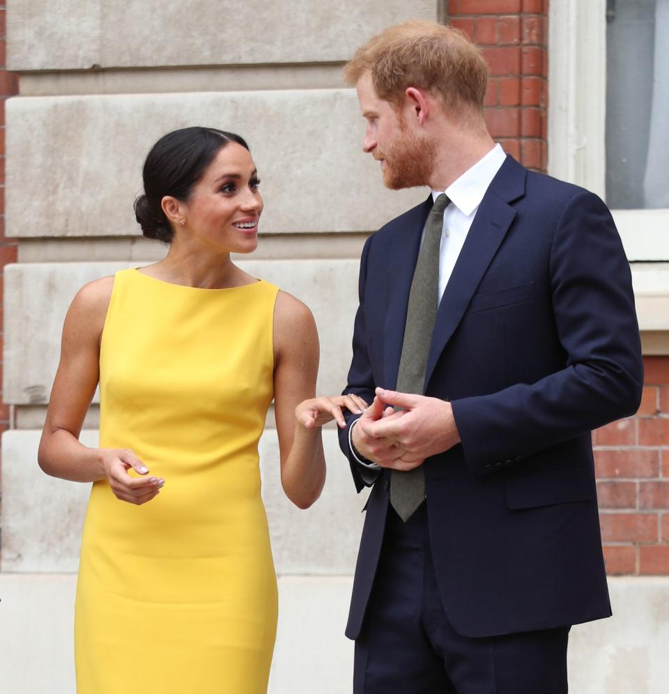 <p>Meghan and Harry shared a sweet look just before the Duke gave a speech at the event. Meghan wore <a href="https://www.townandcountrymag.com/style/fashion-trends/a22062433/meghan-markle-brandon-maxwell-dress-commonwealth-youth-challenge-reception/" rel="nofollow noopener" target="_blank" data-ylk="slk:a bright yellow dress by Brandon Maxwell;elm:context_link;itc:0;sec:content-canvas" class="link ">a bright yellow dress by Brandon Maxwell</a> for the day.</p>