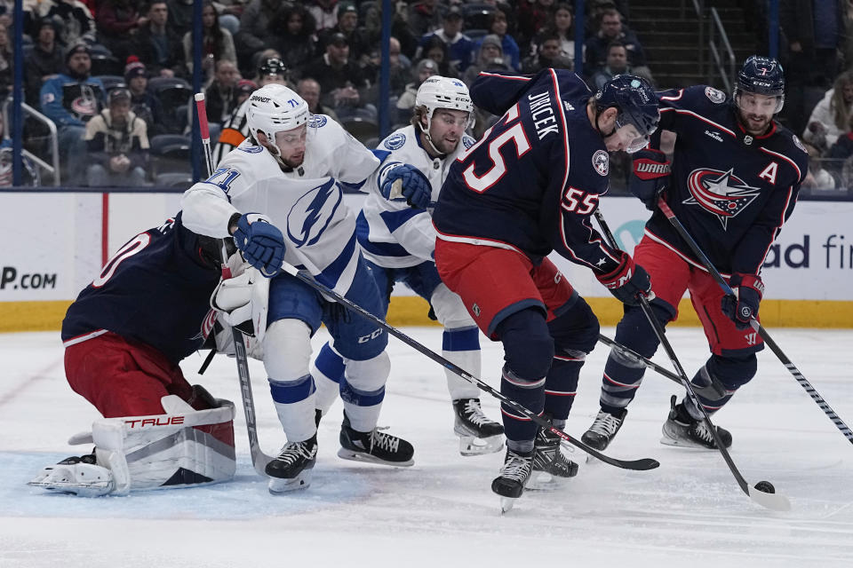 Columbus Blue Jackets defenseman David Jiricek (55) clears the puck in front of Tampa Bay Lightning center Anthony Cirelli (71) during the first period of an NHL hockey game Thursday, Nov. 2, 2023, in Columbus, Ohio. (AP Photo/Sue Ogrocki)