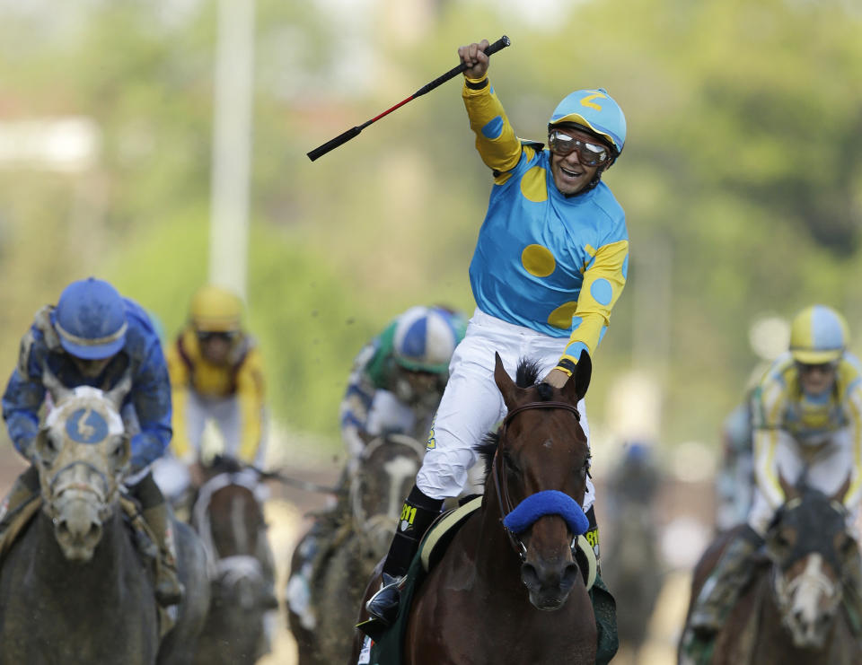 FILE - Victor Espinoza rides American Pharoah to victory in the 141st running of the Kentucky Derby horse race at Churchill Downs Saturday, May 2, 2015, in Louisville, Ky. “There’s nothing like winning the Kentucky Derby,” Espinoza, a three-time winner, said recently. “To me it’s the most important thing in horse racing.” (AP Photo/Darron Cummings, File)