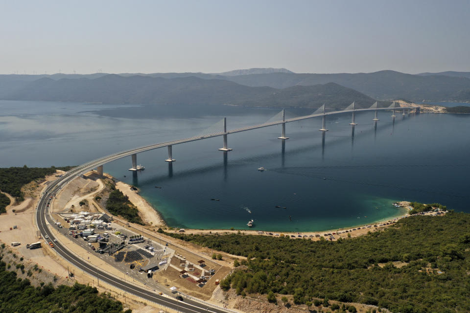 An aerial view of the newly built Peljesac Bridge in Komarna, southern Croatia, Tuesday, July 26, 2022. Croatia is marking the opening of a key and long-awaited bridge connecting two parts of the country's Adriatic Sea coastline while bypassing a small part of Bosnia's territory. (AP Photo)