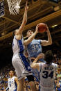 DURHAM, NC - MARCH 03: Miles Plumlee #21 of the Duke Blue Devils and teammate Ryan Kelly #34 try to stop Tyler Zeller #44 of the North Carolina Tar Heels during their game at Cameron Indoor Stadium on March 3, 2012 in Durham, North Carolina. (Photo by Streeter Lecka/Getty Images)