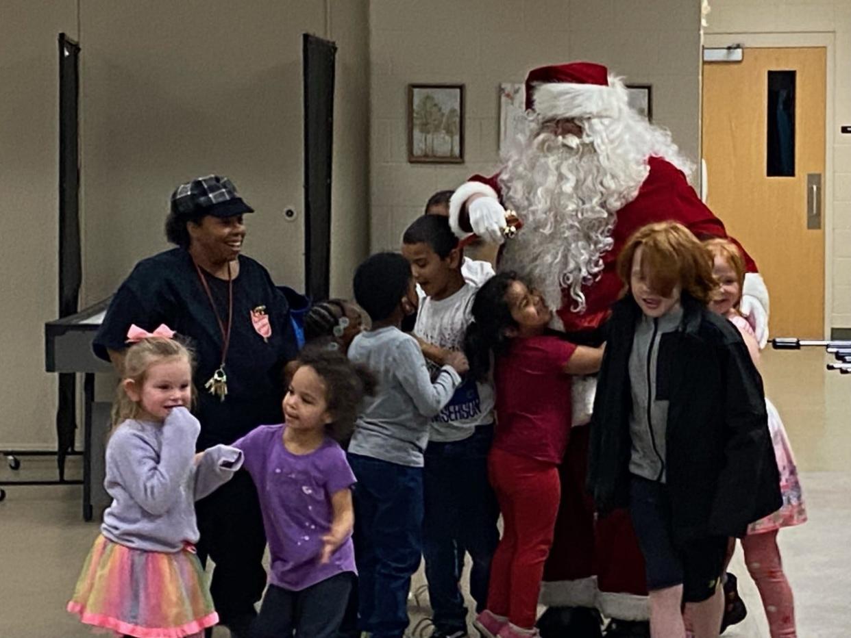 Santa visited with children at the Monroe Kiwanis Club's recent Christmas party, held at the Salvation Army Campus of Hope.