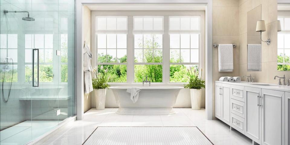 clean white bathroom with windows open