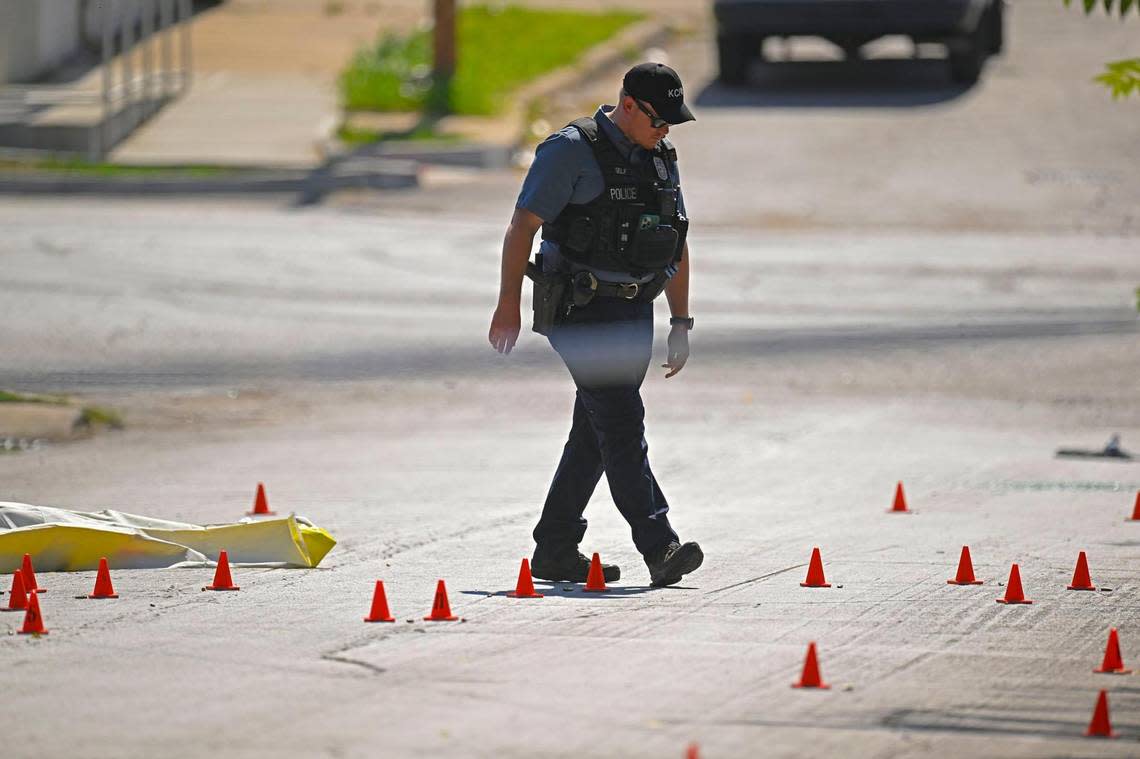 Evidence markers filled the street as police were investigating the scene after three people died and five were injured following a shooting early Sunday, June 25, 2023, near 57th Street and Prospect Avenue in Kansas City.