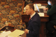 Kansas state Sen. Ethan Corson, D-Prairie Village, reacts to comments during a debate on a bill that would bar transgender students from girls' and women's school sports at the Statehouse, Wednesday, March 17, 2021, in Topeka, Kan. Corson opposes the measure. (AP Photo/John Hanna)