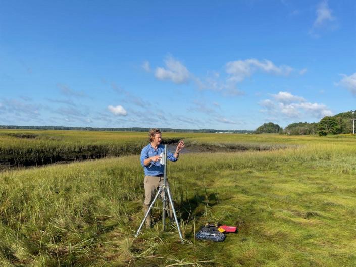 Gregg Moore, associate professor of biological sciences at the University of New Hampshire, sets up wireless water level recorders in the Hampton Seabrook Estuary to set a baseline for salt marsh tidal regime that will inform future resilience actions.