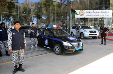 Police officers are seen outside a building of parliament headquarters during the first session of lawmakers allied to Libya's internationally recognized government in Tripoli, Libya, May 2, 2019. REUTERS/Hani Amara