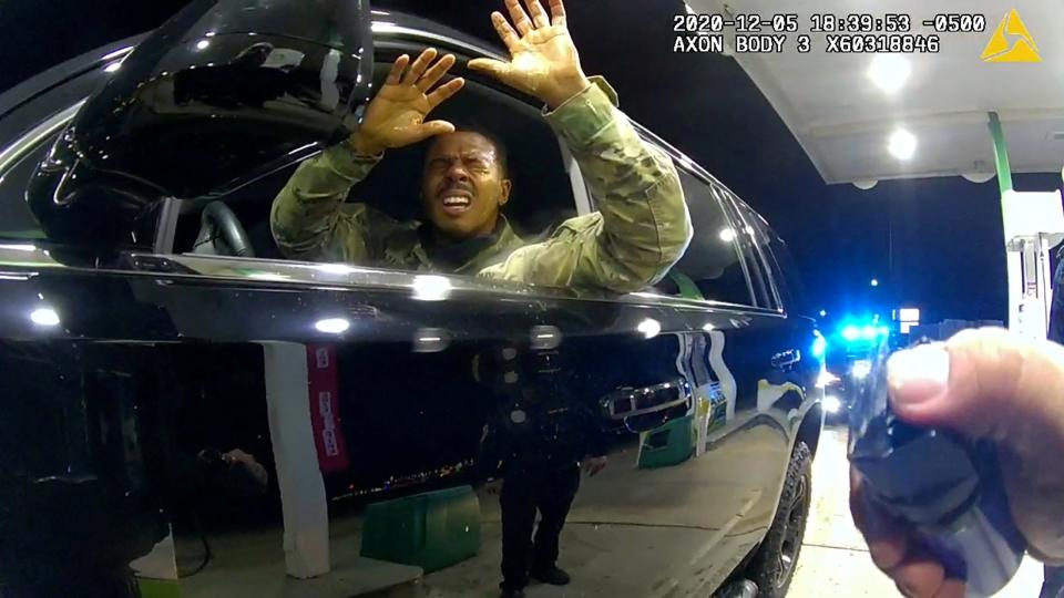 <p>US Army 2nd Lieutenant Caron Nazario reacts as he holds up his hands after being sprayed with a chemical agent by Windsor police officer Joe Gutierrez during a violent traffic stop at a gas station</p> (REUTERS)