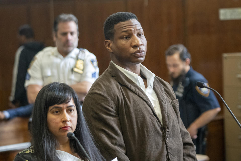 Jonathan Majors stands in court during a hearing in his domestic violence case, Tuesday, June 20, 2023 in New York. Majors’ domestic violence case will go to trial Aug. 3, the judge said Tuesday, casting him in a real-life courtroom drama as his idled Hollywood career hangs in the balance. (AP Photo/Steven Hirsch, Pool)