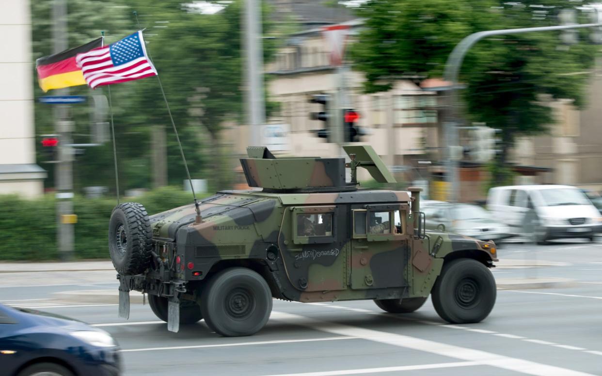 Mandatory Credit: Photo by ARNO BURGI/EPA-EFE/Shutterstock (10730669a) (FILE) - A High Mobility Multipurpose Wheeled Vehicle (HMMWV or also Humvee) of the US armed forces in Europe drives from the Military History Museum through the city towards the Autobahn in Dresden, Germany, 01 June 2016 (reissued 02 August 2020). According to media reports, the US government wants to reduce the number of soldiers stationed in Germany by up to 12,000. US to withdraw up to 12,000 soldiers from Germany, Dresden - 01 Jun 2016 - ARNO BURGI/EPA-EFE/Shutterstock
