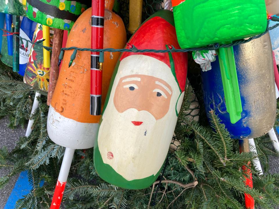 A buoy decorated as Santa Claus on Kittery's first holiday lobster buoy tree, seen Tuesday, Dec. 1, 2021.
