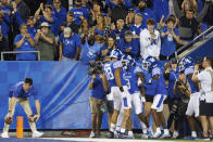 Fans celebrate after Kentucky wide receiver Tayvion Robinson (9) scores a touchdown during the first half of an NCAA college football game against Northern Illinois in Lexington, Ky., Saturday, Sept. 24, 2022. (AP Photo/Michael Clubb)