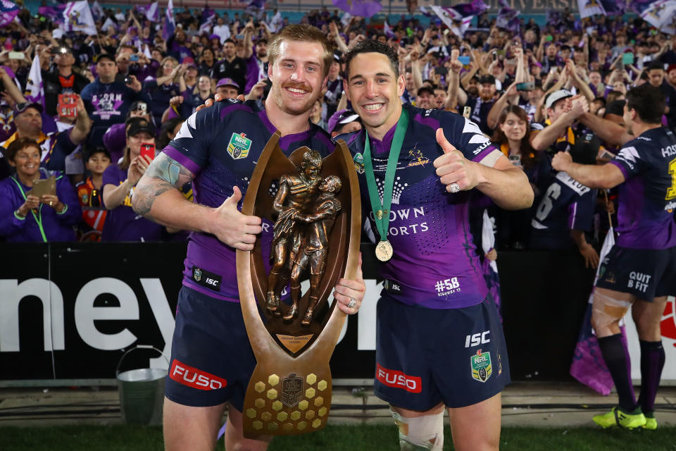 Cameron Munster (pictured left) celebrates with Billy Slater (pictured right) during the 2017 NRL Grand Final match.