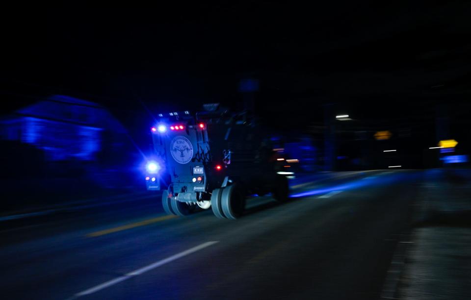 An emergency services unit vehicle speeds along Route 126 in Lewiston.