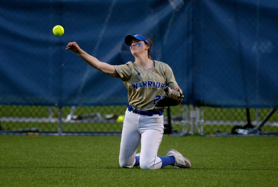 Schroeder right fielder Ava West throws the ball back into the infield after a base hit by Thomas’s Ella Maloney.